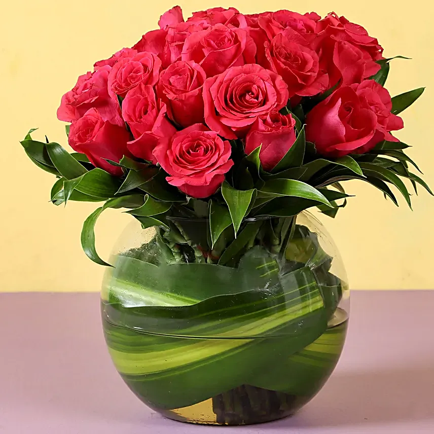 Love in the air - 30 pink roses are nicely arranged in a fish bowl glass vase.