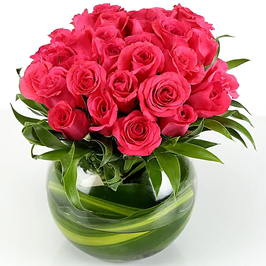 Love in the air - 30 pink roses are nicely arranged in a fish bowl glass vase.