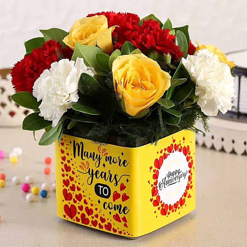 Mixed Carnations and Yellow Roses In Anniversary Vase