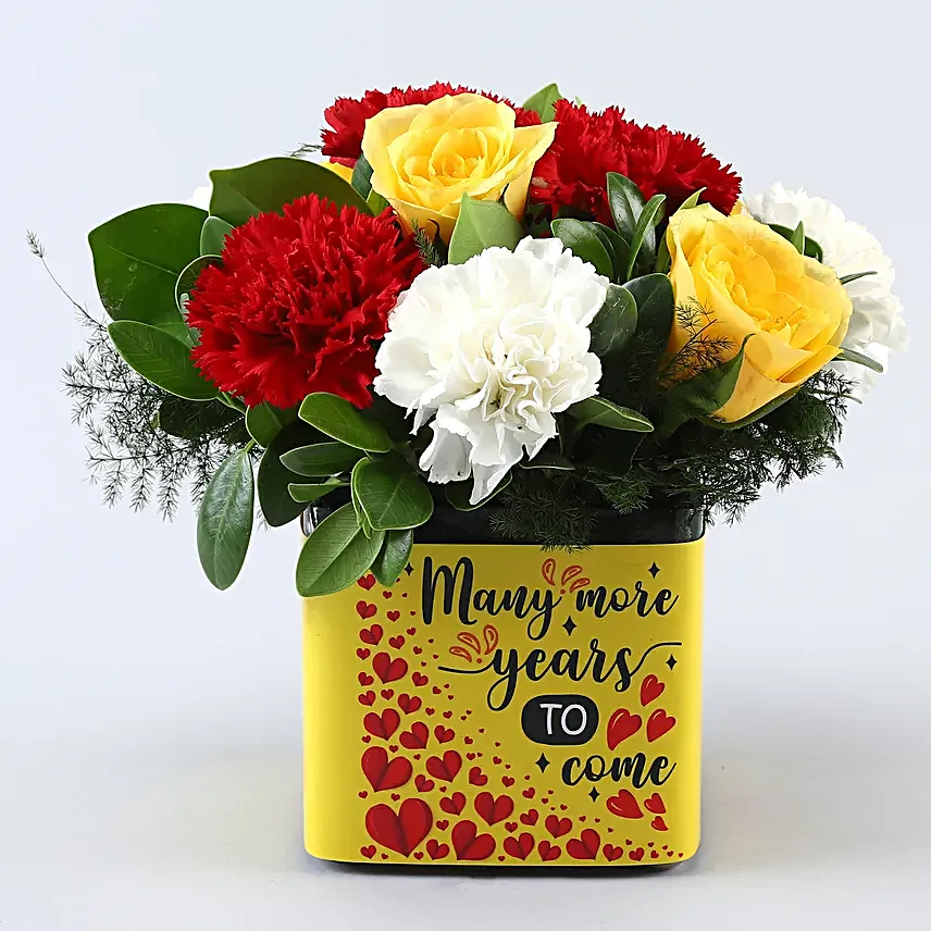 Mixed Carnations and Yellow Roses In Anniversary Vase