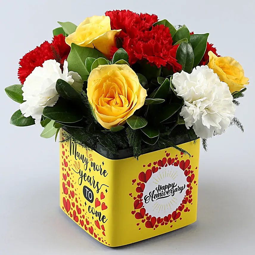 Mixed Carnations and Yellow Roses In Anniversary Vase