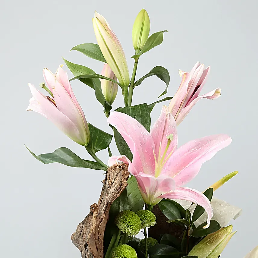 Mixed Flowers In Cylindrical Wooden Vase