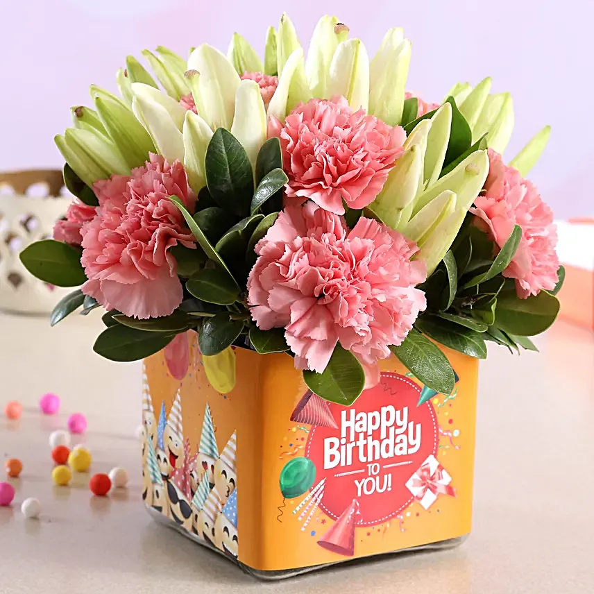 Pink Carnations and White Lilies In Orange Birthday Vase