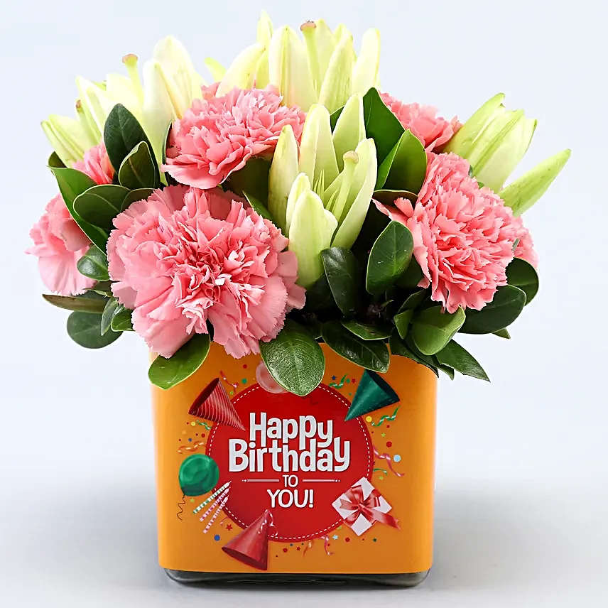 Pink Carnations and White Lilies In Orange Birthday Vase