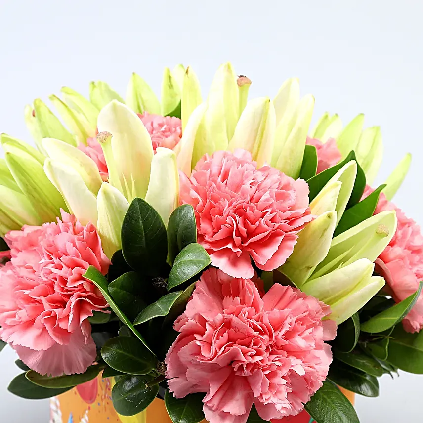 Pink Carnations and White Lilies In Orange Birthday Vase
