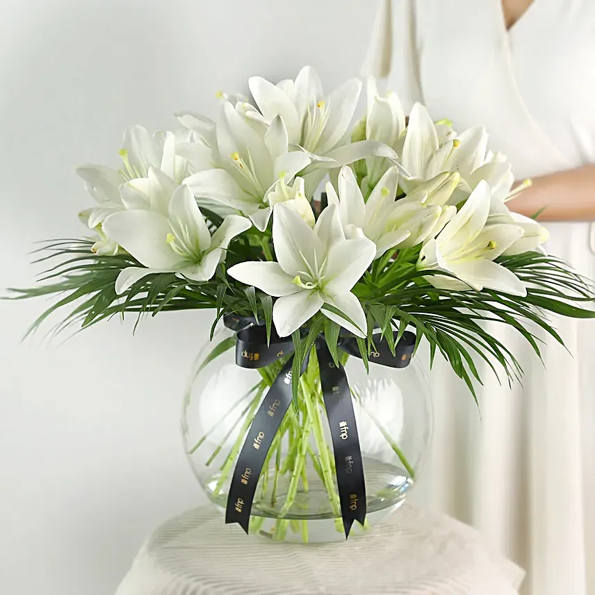Pure White Asiatic Lilies In Fishbowl Vase