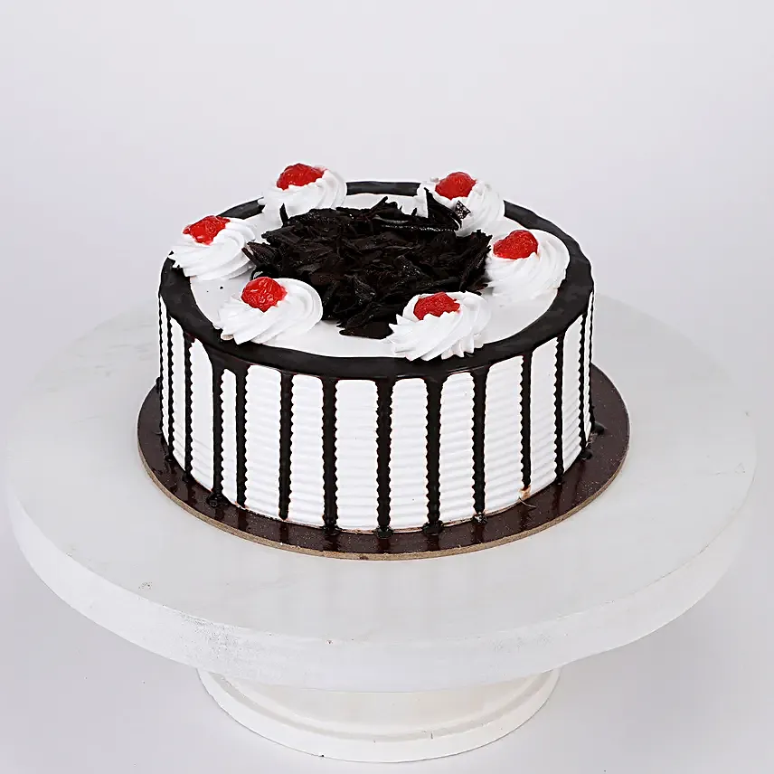 Online Dairy Milk Orchids Bouquet And Black Forest Cake
