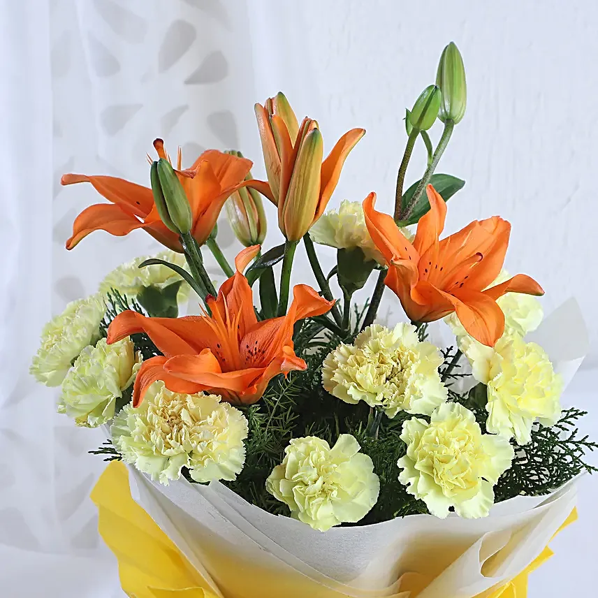 Radiance - Bunch of 10 yellow carnations 2 orange lilies in paper packing.