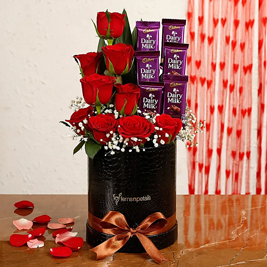 Red Roses Dairy Milk Arrangement In Round FNP Box