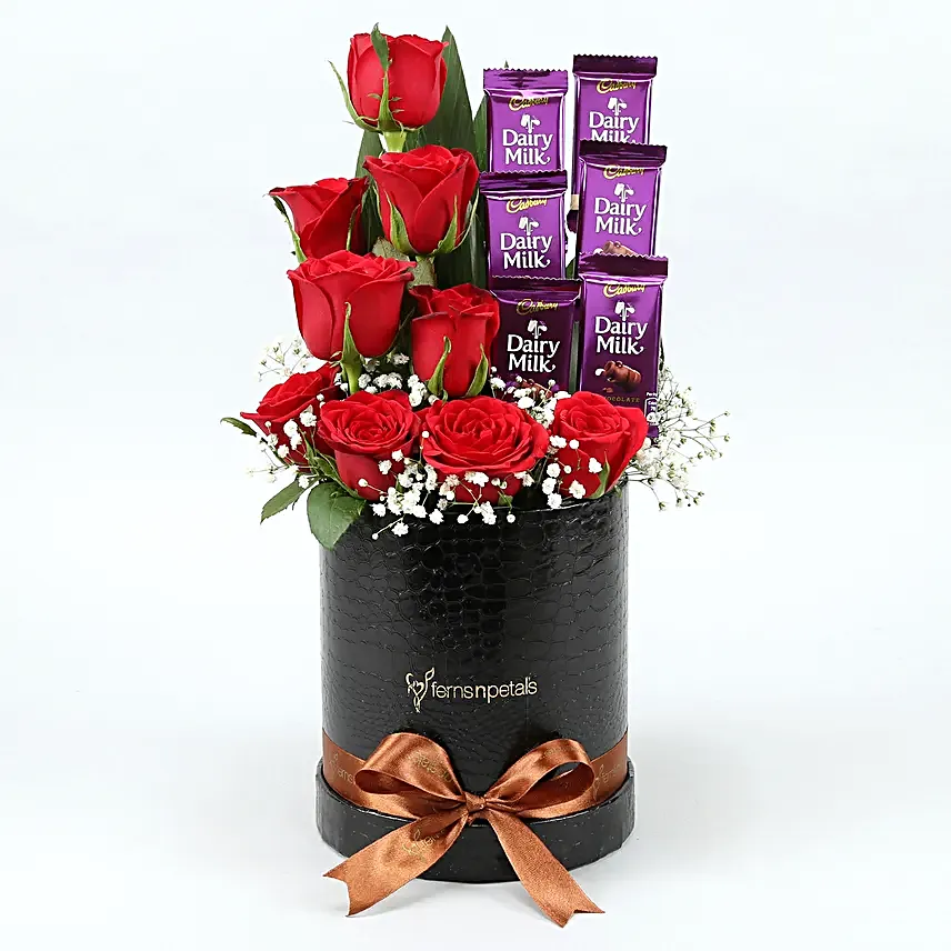 Red Roses Dairy Milk Arrangement In Round FNP Box
