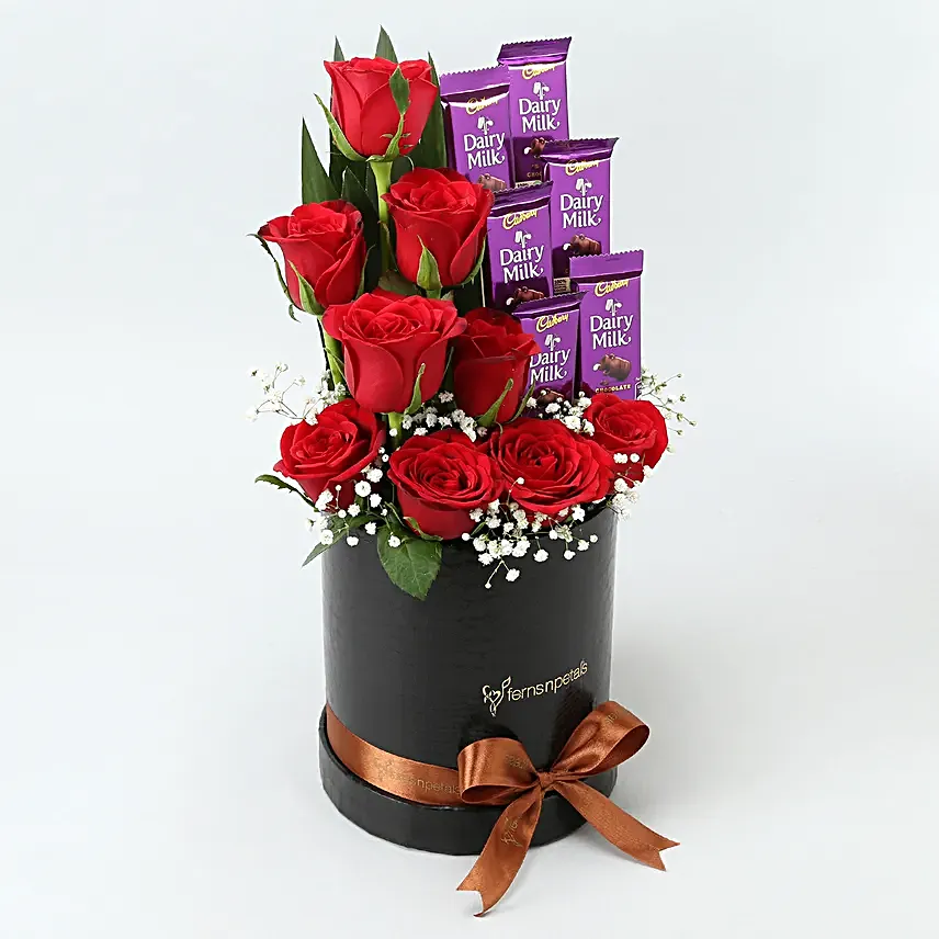 Red Roses Dairy Milk Arrangement In Round FNP Box