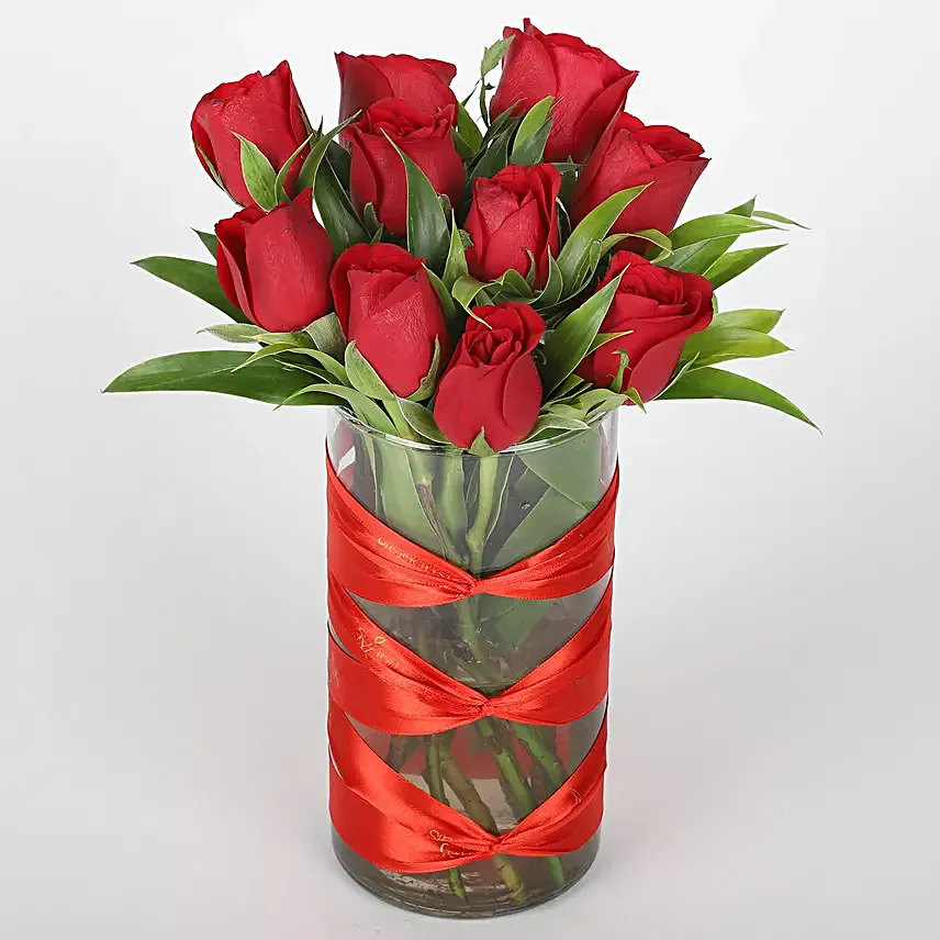 Roses in attractive vase with silk chocolates