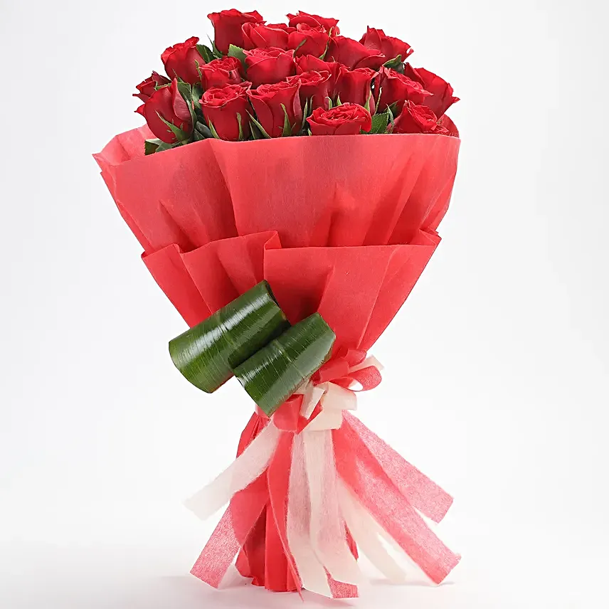 Bunch of 20 red roses with draceane leaves