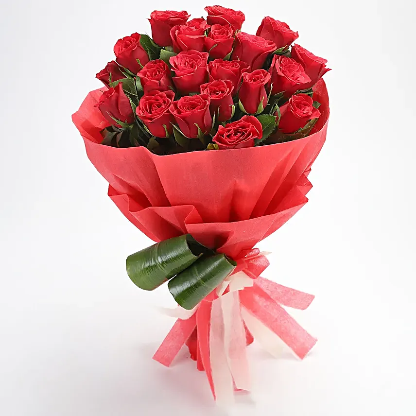 Bunch of 20 red roses with draceane leaves