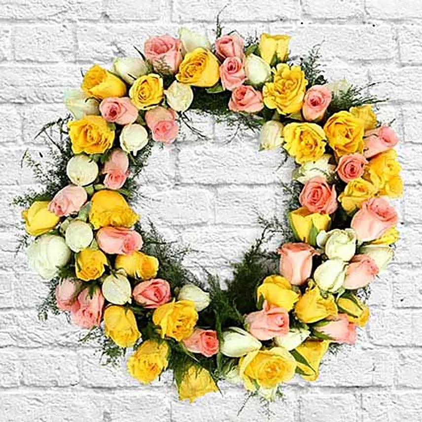 Roses and seasonal filler in wreath