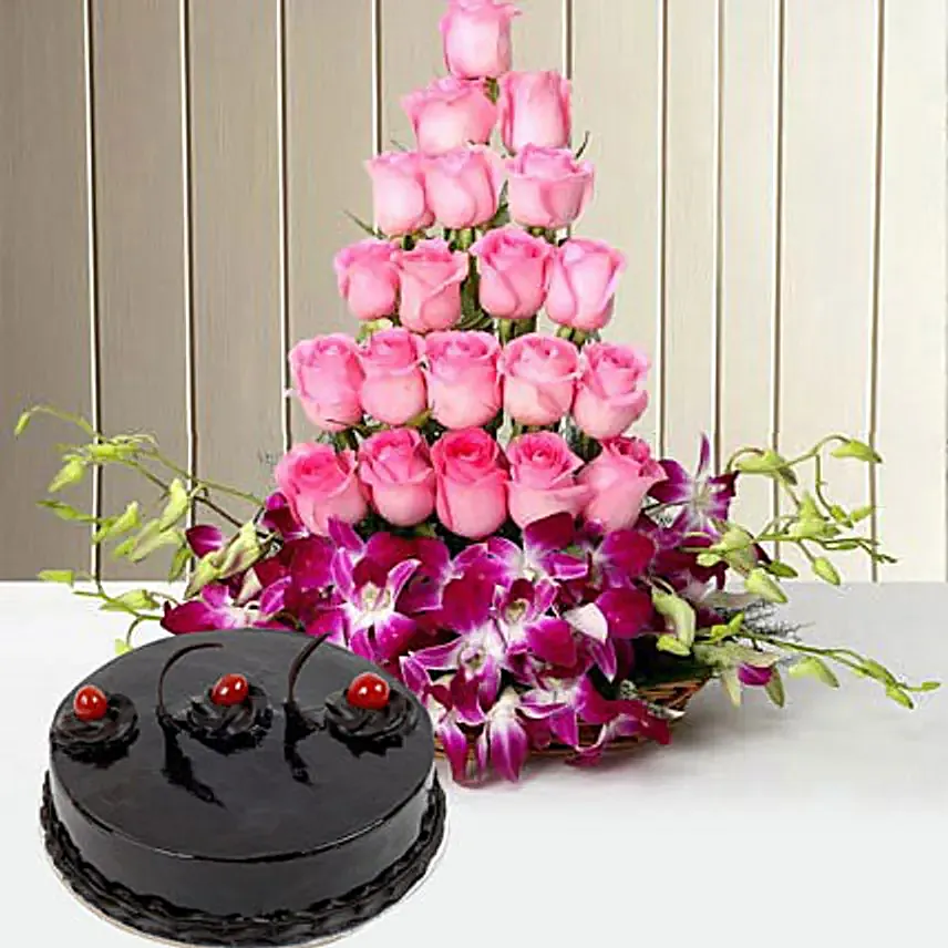 Combo of a cane Basket arrangement of 20 pink roses and 6 purple orchids with 500 grams truffle cake