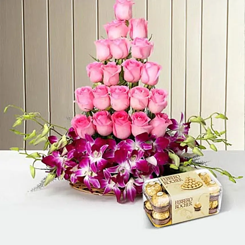 Combo of a cane Basket arrangement of 20 pink roses and 6 purple orchids with 16 pieces of ferrero rocher chocolates
