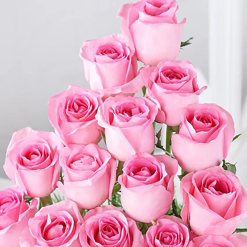 Cane Basket arrangement of 20 pink roses and 6 purple orchids