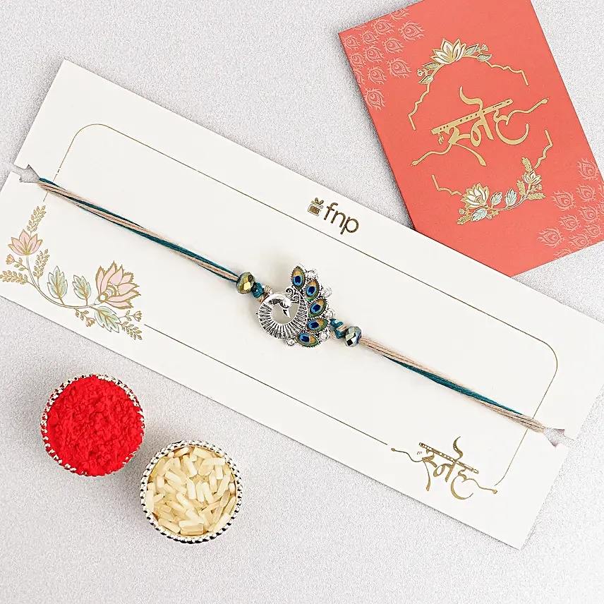 Sapphire Serenity Peacock Rakhi with Dodha Barfi Combo