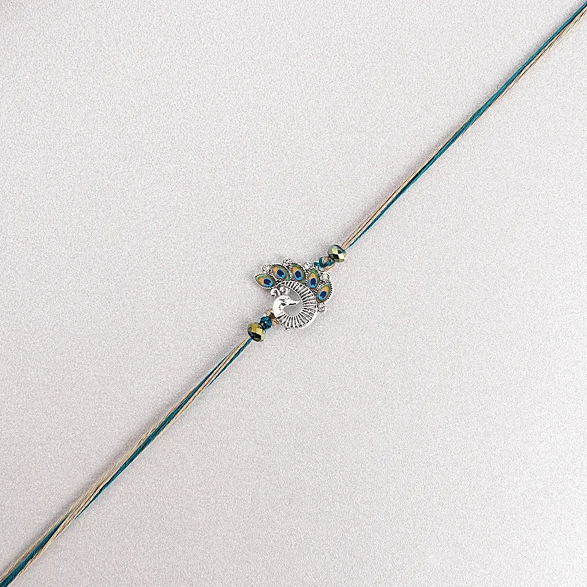 Sapphire Serenity Peacock Rakhi with Dodha Barfi Combo