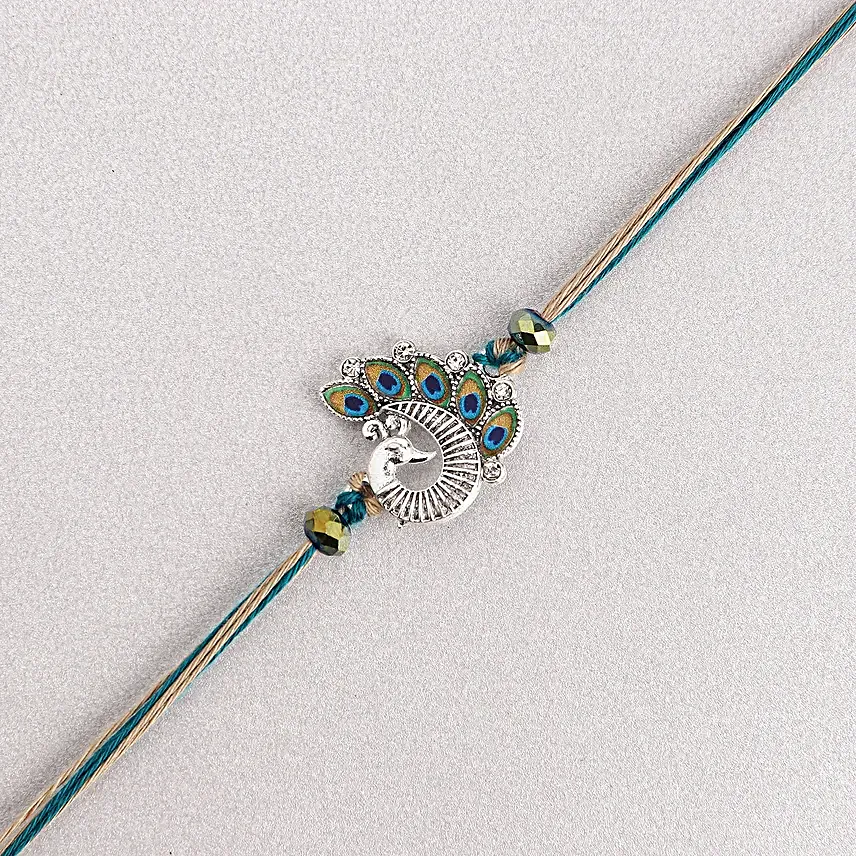 Sapphire Serenity Peacock Rakhi with Dodha Barfi Combo