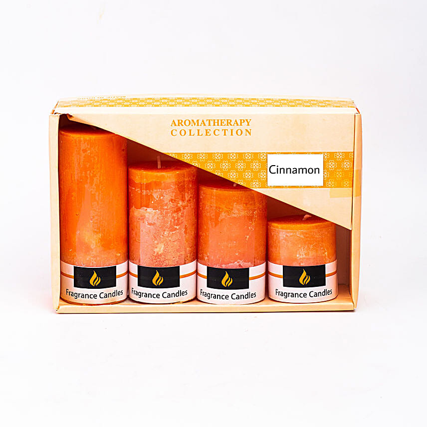 Set Of 4 Orange Pillar Candles Cinnamon