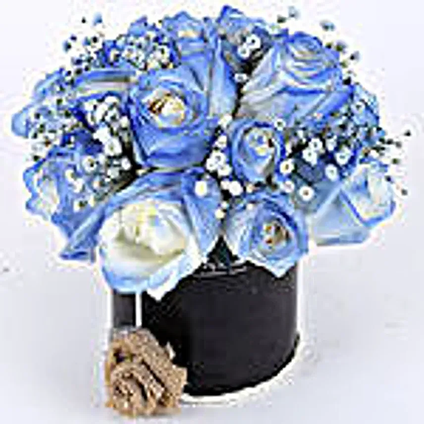 blue roses arrangement in black box