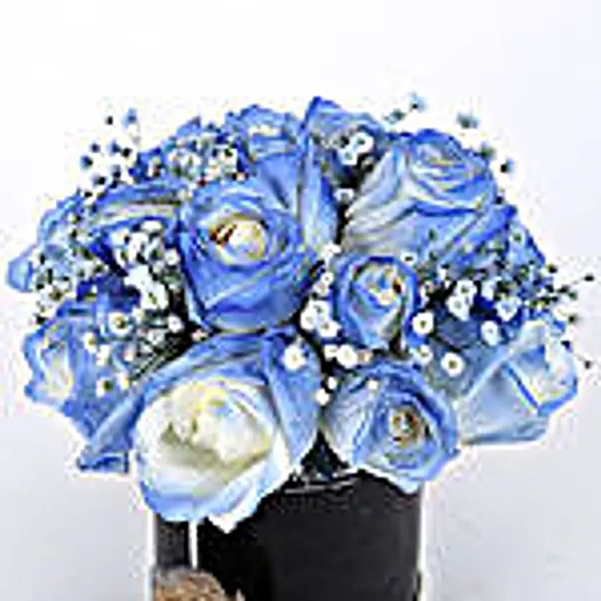 blue roses arrangement in black box