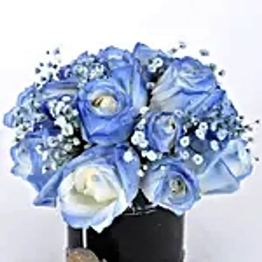 blue roses arrangement in black box