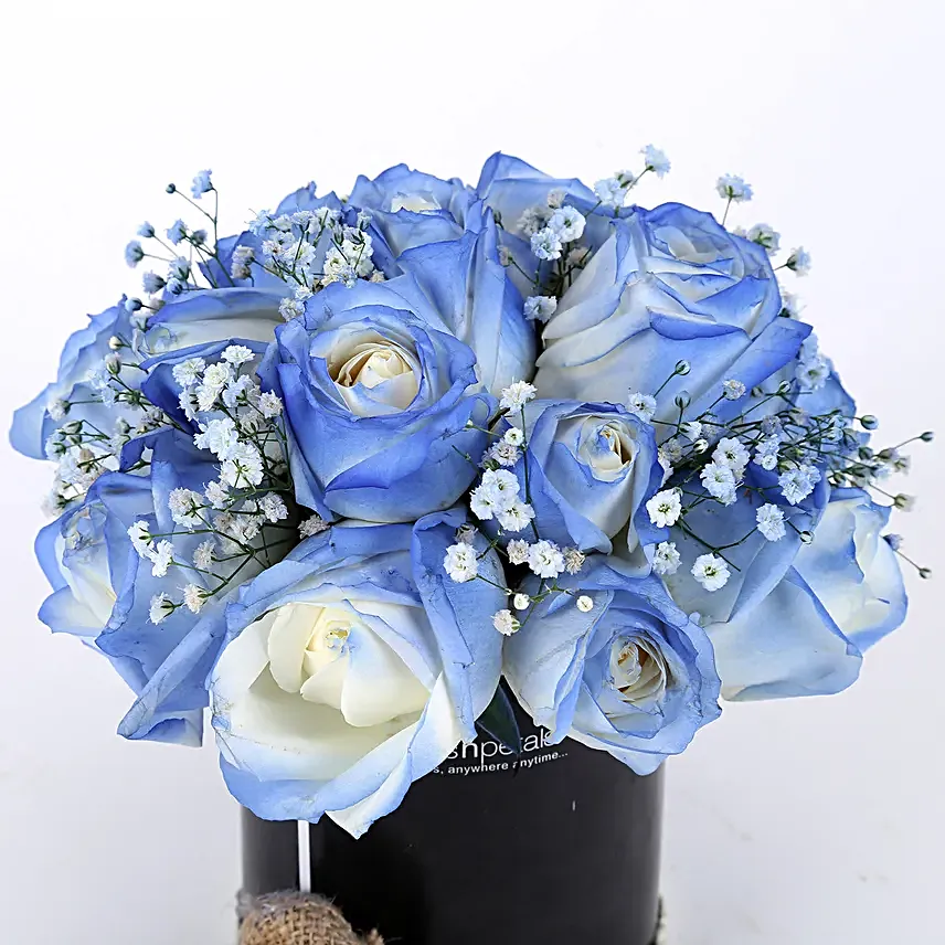blue roses arrangement in black box