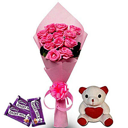 Pretty Pink hamper - Bunch of 12 Pink Roses in Pink color paper packing, 6 inch height  and 3 Cadbury dairy milk chocolate of 38gms each.