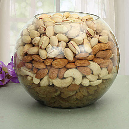 Glass vase filled with dry fruits