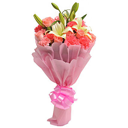 Carnations N Lilies - Bunch of 20 Mix flowers in pink paper packing.
