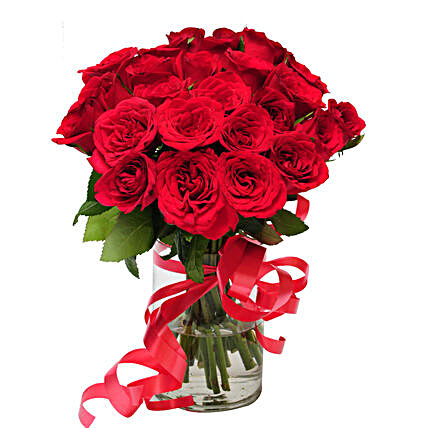 Pure delight - Glass vase arrangement of 24 red roses.