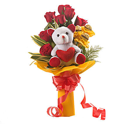 Bouquet of red roses with chocolates and
