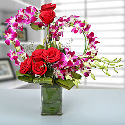 Red rose, purple orchid arrangement