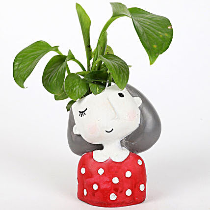 money plant in girl shaped pot