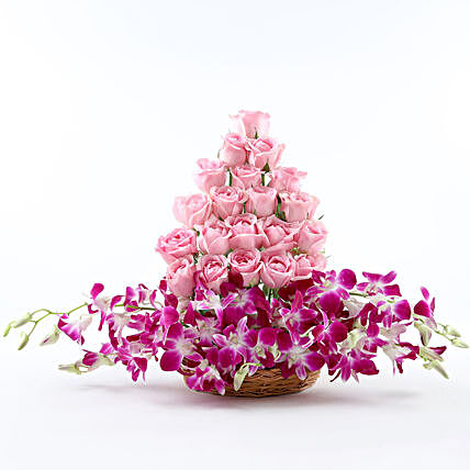 Cane Basket arrangement of 20 pink roses and 6 purple orchids womens day women day woman day women's day:Gifts To Nehru Place