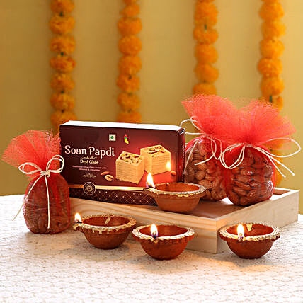 Dry fruits, sweets and a greeting card