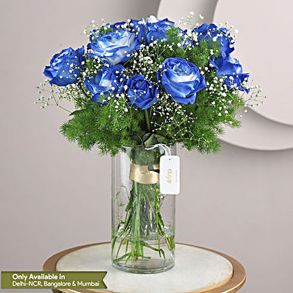 exotic blue shade roses in glass vase arrangement