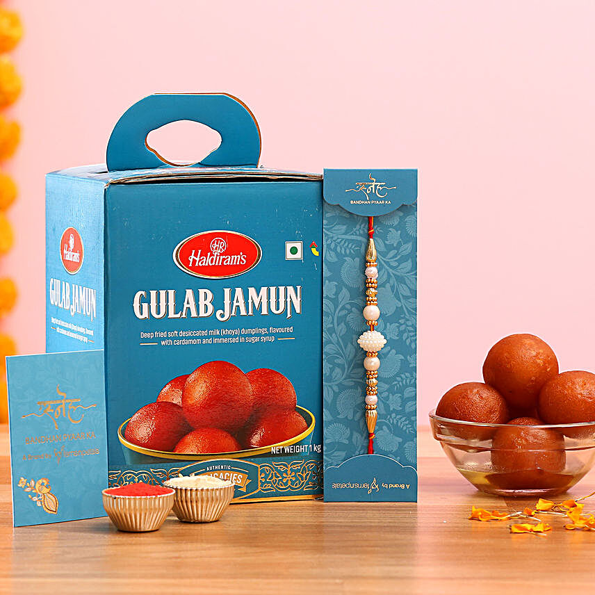 White Pearl Mauli Rakhi And Gulab Jamun:Rakhi with Sweets to Malaysia