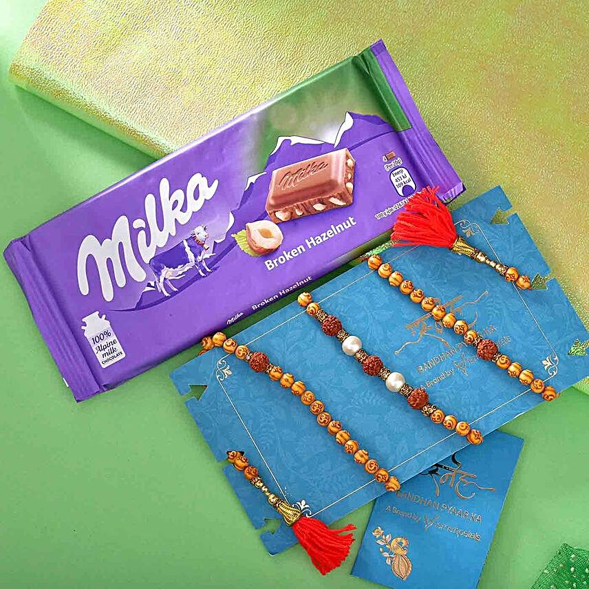 Sneh Om Rudraksha Bracelet Rakhi & Milka Chocolate:Bracelet Rakhi to Malaysia