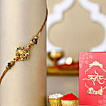 Celestial Ganesha Serenade Rakhi with Channa Barfi Combo