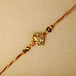 Celestial Ganesha Serenade Rakhi with Channa Barfi Combo