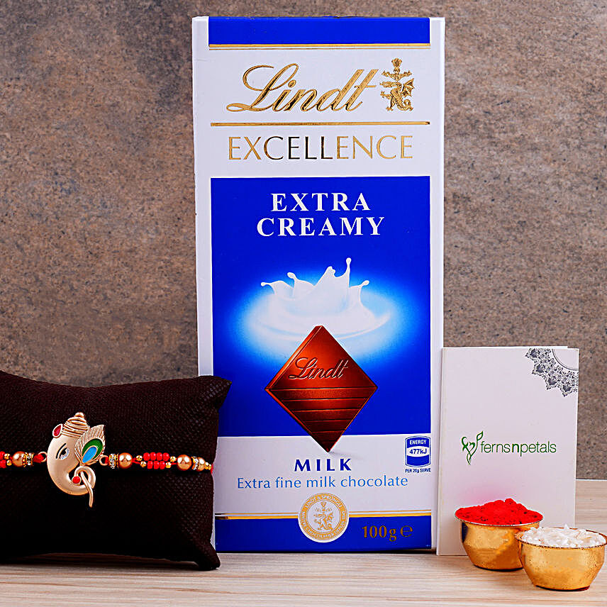 Alluring Silver Ganesha Rakhi And Lindt Chocolate