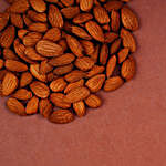 Orange Pearl And Lumba Rakhi Set With 250 Gms Almonds