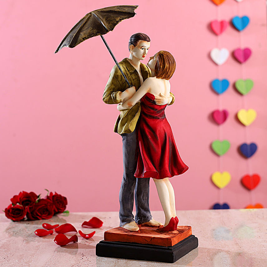 Hugging Couple Under Umbrella Figurine