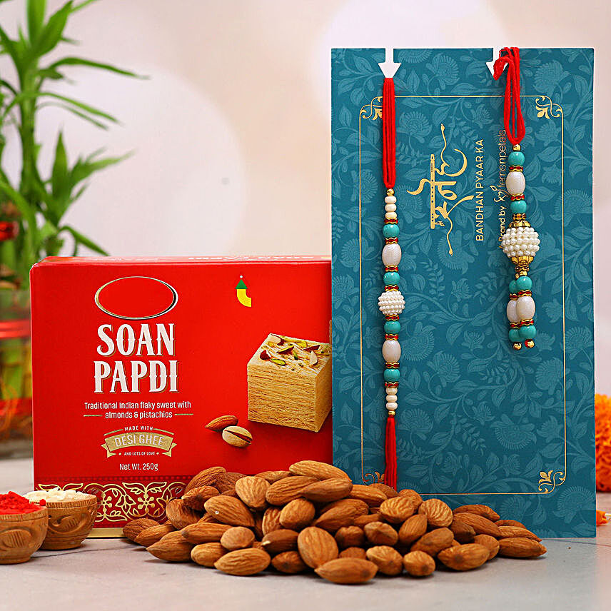 Blue Pearl Lumba Rakhi Set And Almonds With Soan Papdi:Bhaiya Bhabhi Rakhi to NZ