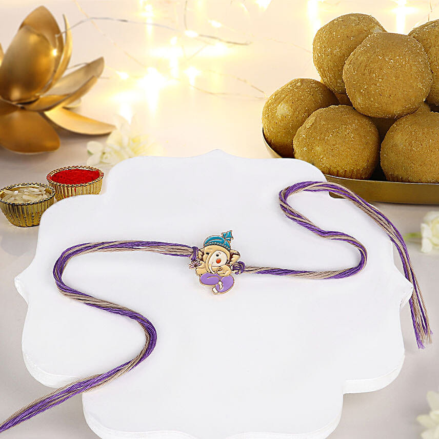 Bal Ganesha Cheerful Charm Rakhi N Besan Laddoo Treat