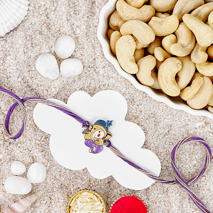 Bal Ganesha Cheerful Charm Rakhi N Cashew Indulgence Pack